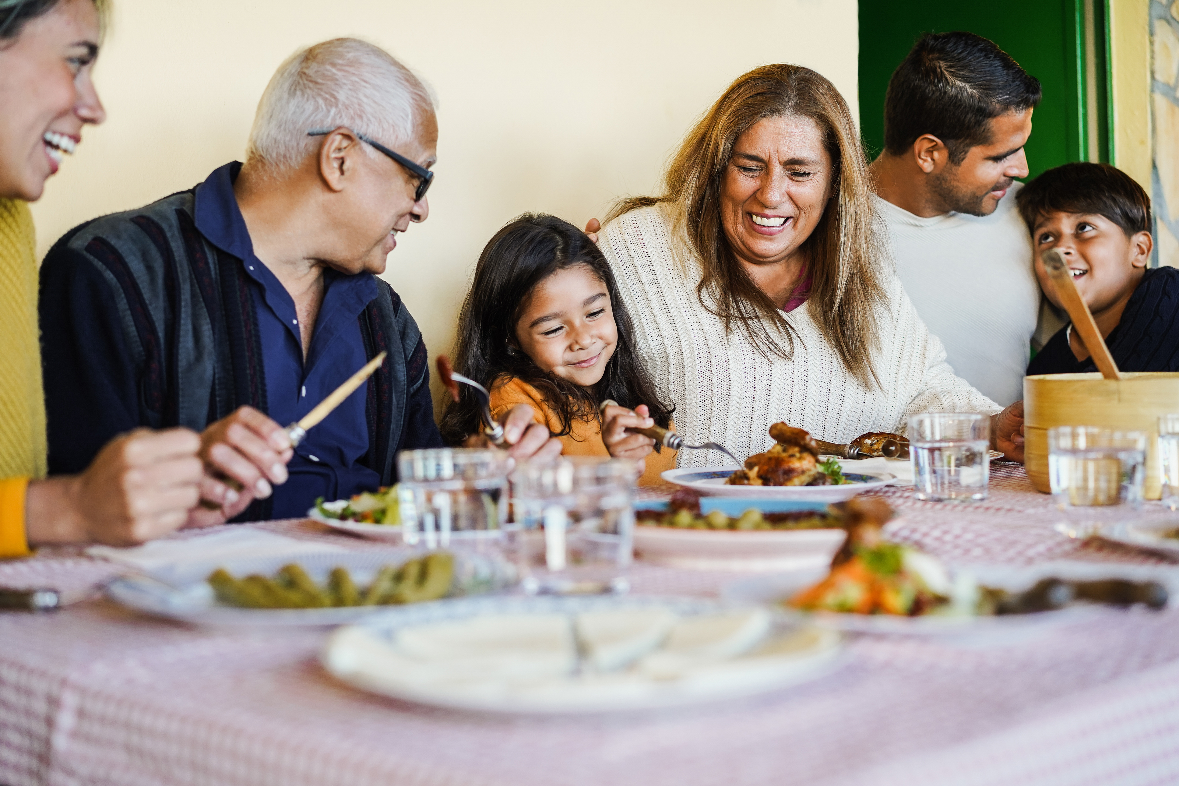 Multigenerational family enjoying a meal together at a restaurant